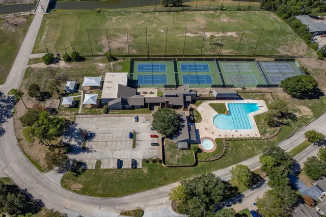 an aerial view of a house with outdoor space
