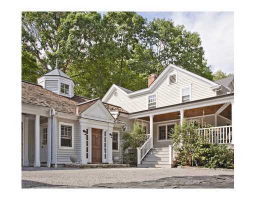 336 Stanwich Road Greenwich, CT 06830 - Photo 1 of 7 a front view of a house with a yard