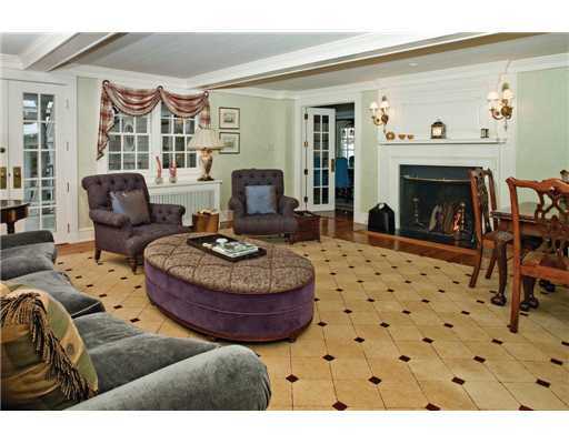 336 Stanwich Road Greenwich, CT 06830 - Photo 3 of 7 a living room with furniture a fireplace and a flat screen tv