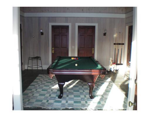 336 Stanwich Road Greenwich, CT 06830 - Photo 5 of 7 a room that has a rug and a wooden bench in it