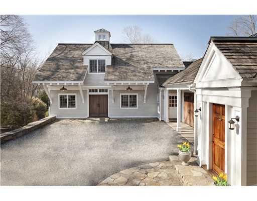 336 Stanwich Road Greenwich, CT 06830 - Photo 7 of 7 a front view of a house with a garden