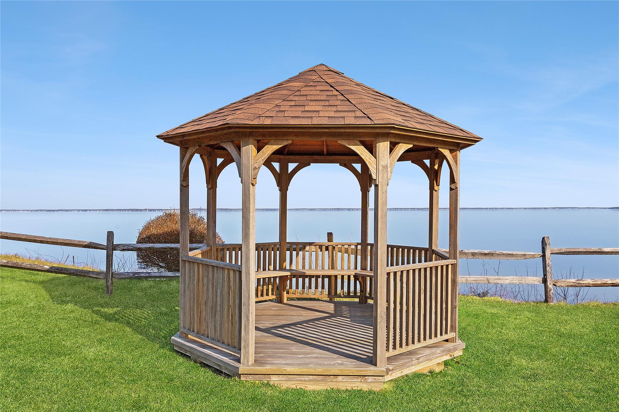 67 North Road, Unit A Hampton Bays, NY 11946 - Photo 13 of 17 Dock with a gazebo and a deck with water view