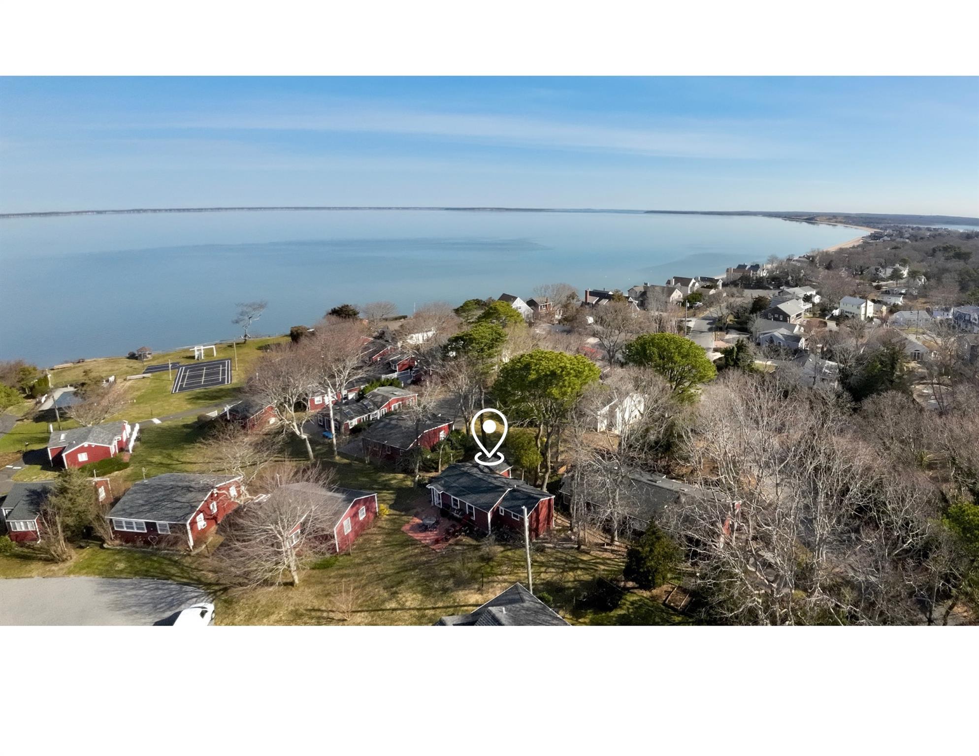 67 North Road, Unit A Hampton Bays, NY 11946 - Photo 2 of 17 Aerial view of residential area featuring a nearby body of water