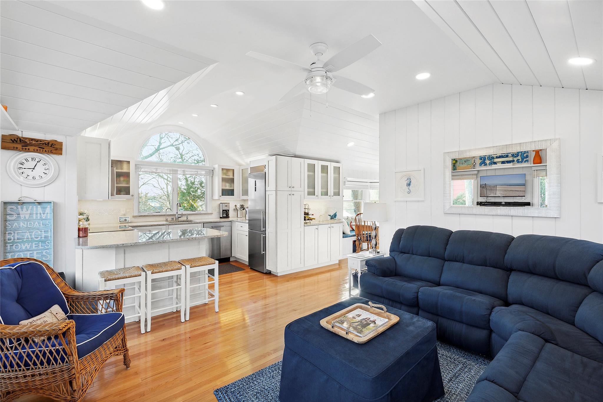 67 North Road, Unit A Hampton Bays, NY 11946 - Photo 4 of 17 Living room featuring lofted ceiling, light wood-style flooring, a ceiling fan, and recessed lighting