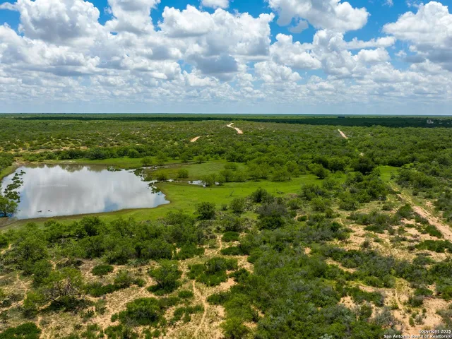 a view of swimming pool with a yard
