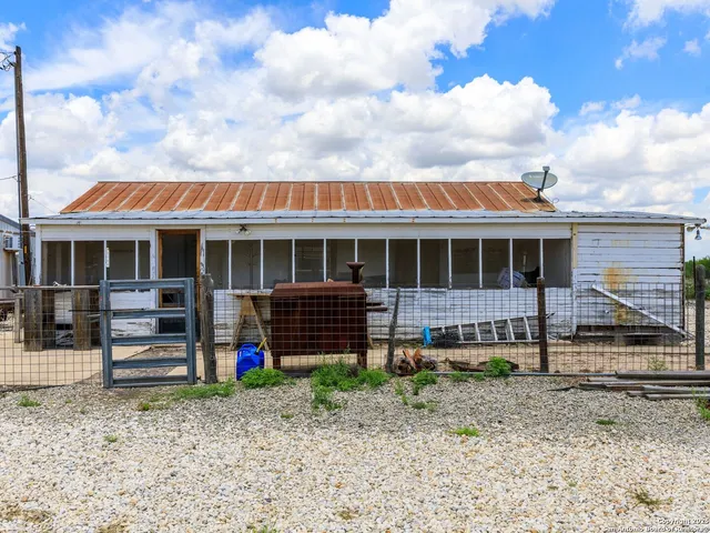 a view of a lake with outdoor seating space