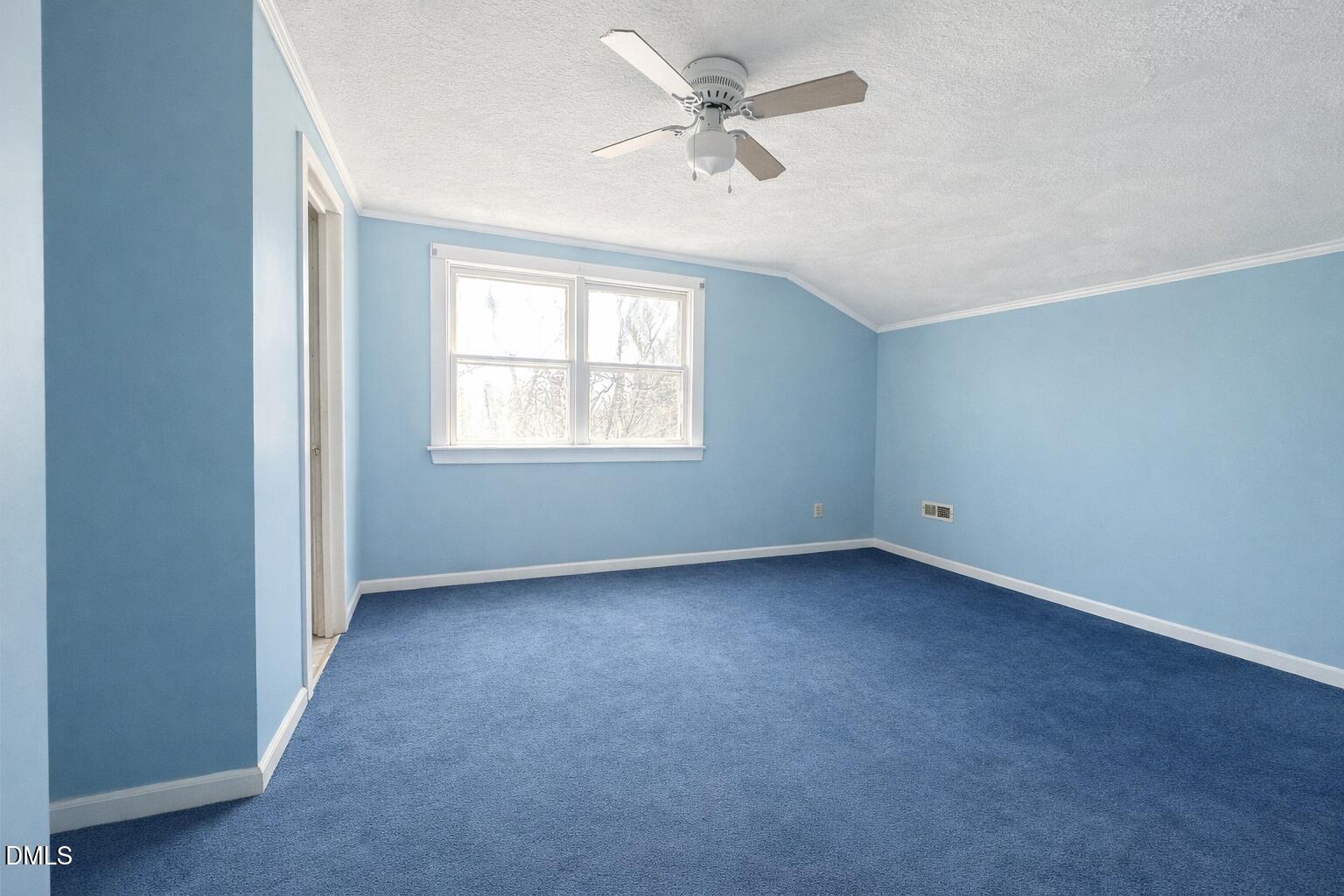 151 Watson Road Norlina, NC 27563 - Photo 11 of 16 an empty room with a window and a fan