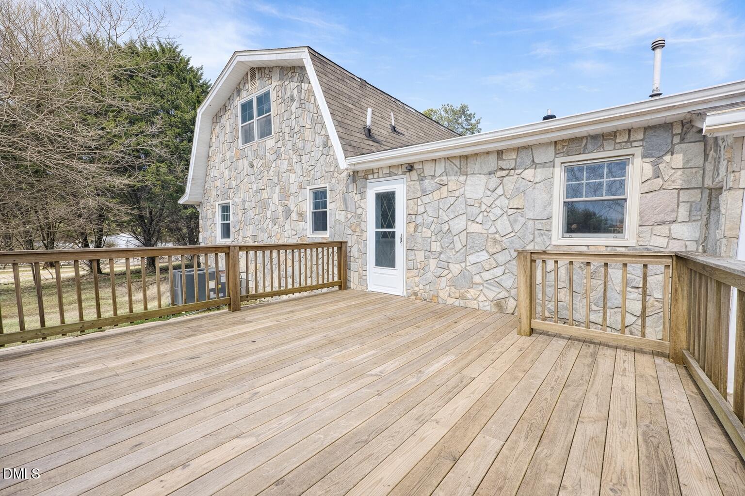 151 Watson Road Norlina, NC 27563 - Photo 14 of 16 a view of a wooden deck with a yard
