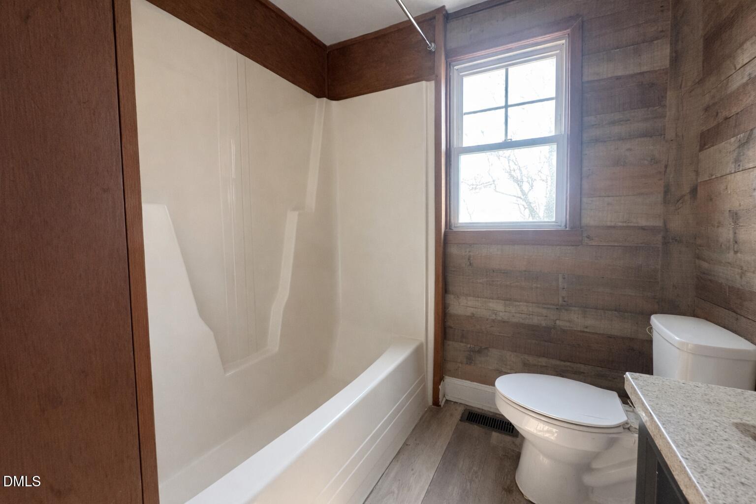 151 Watson Road Norlina, NC 27563 - Photo 9 of 16 a white toilet sitting next to a bath tub