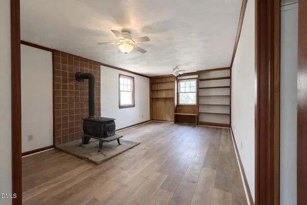 a view of livingroom with hardwood floor and a ceiling fan
