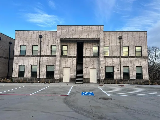 a view of a building with a street