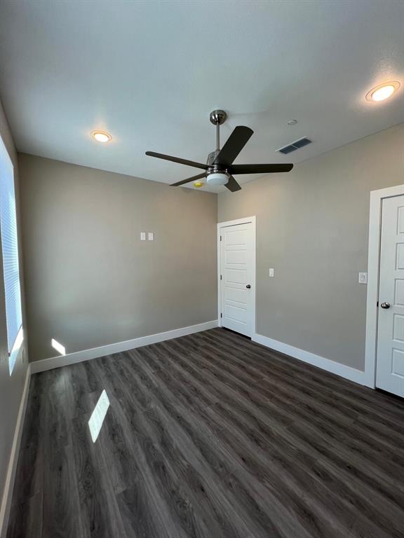 443 Richlands Way Fate, TX 75087 - Photo 19 of 20 Spare room featuring dark wood-type flooring, recessed lighting, and a ceiling fan