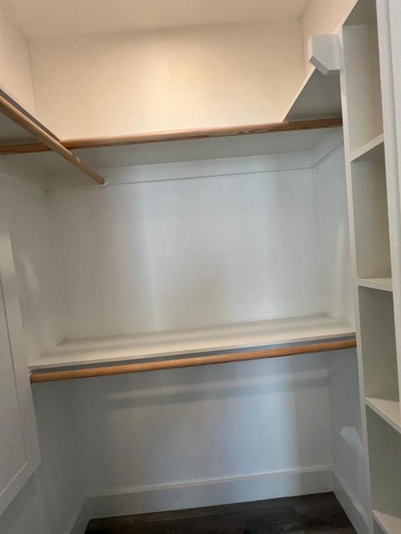 443 Richlands Way Fate, TX 75087 - Photo 9 of 20 Spacious closet with dark wood-style floors