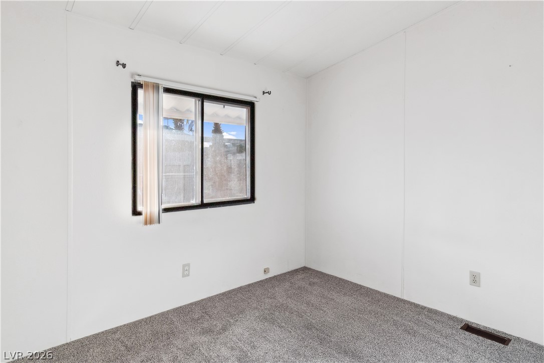 1671 Granada Street Laughlin, NV 89029 - Photo 16 of 63 Unfurnished room with carpet flooring and visible vents