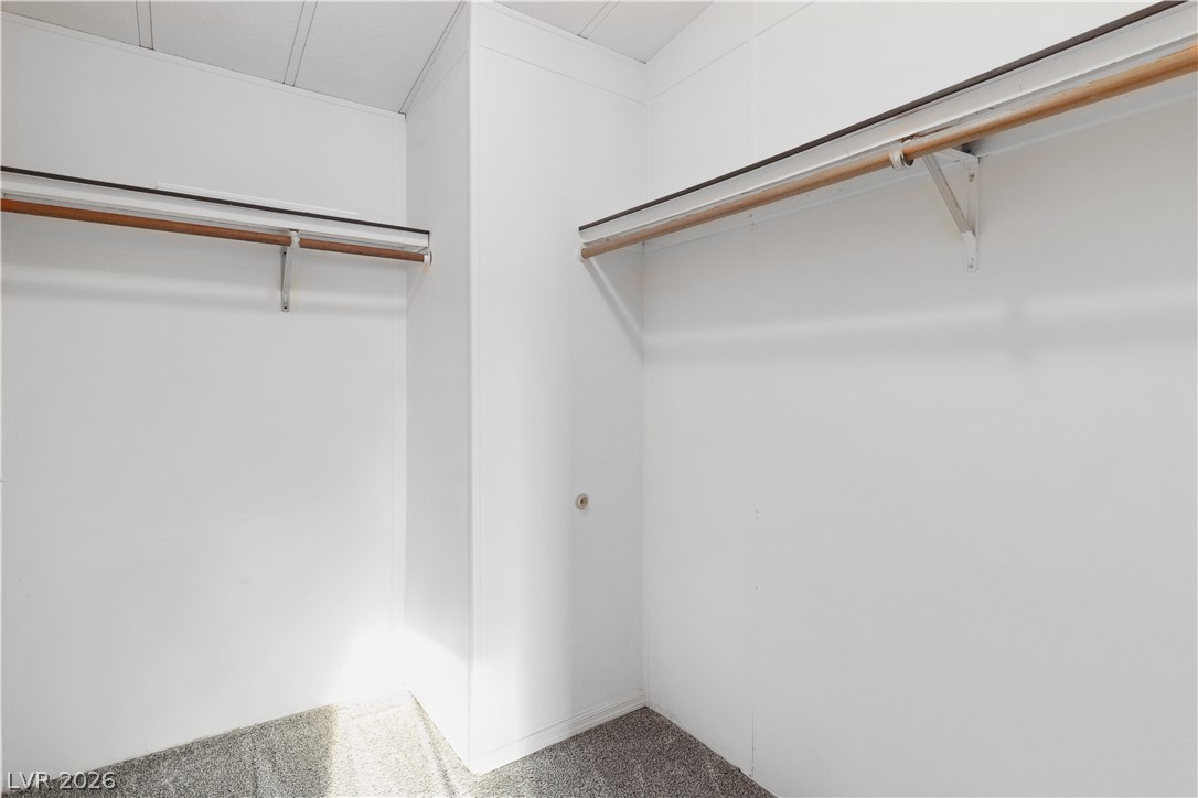 1671 Granada Street Laughlin, NV 89029 - Photo 23 of 63 Spacious walk-in closet with carpet flooring