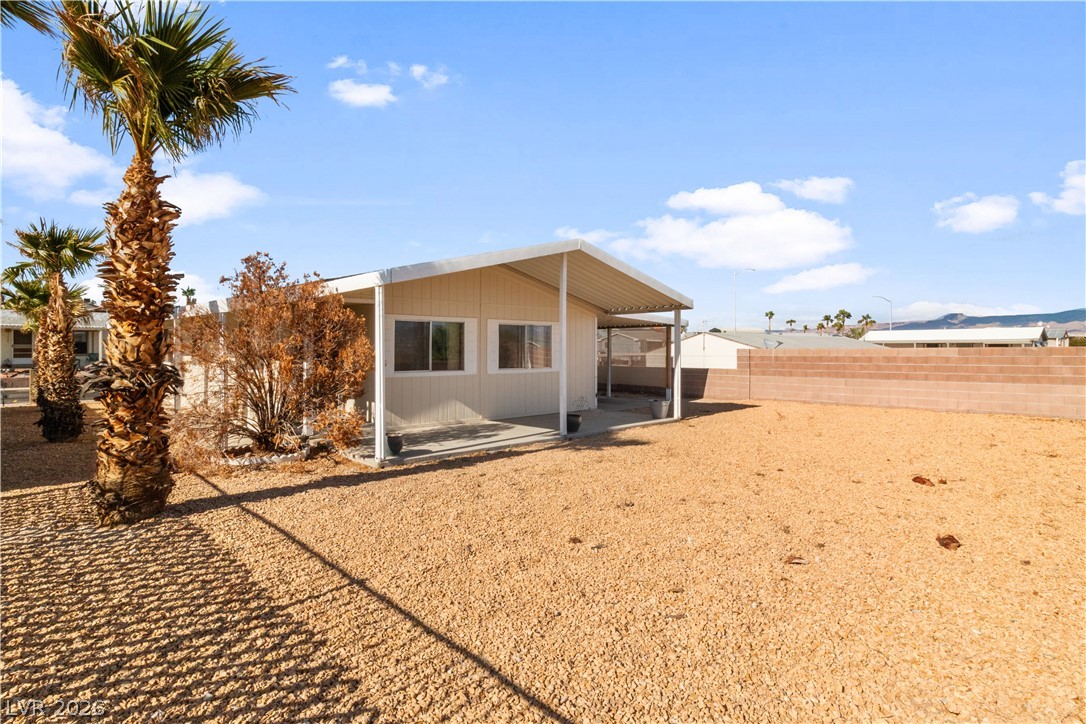 1671 Granada Street Laughlin, NV 89029 - Photo 38 of 63 Back of property featuring a patio area and a fenced backyard