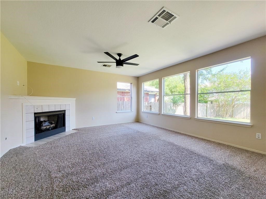 610 Cenizo Path Cedar Park, TX 78613 - Photo 4 of 18 a view of an empty room with a window and fireplace