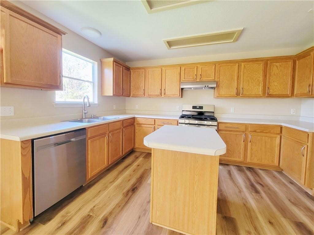 610 Cenizo Path Cedar Park, TX 78613 - Photo 6 of 18 a kitchen with a sink a stove and cabinets