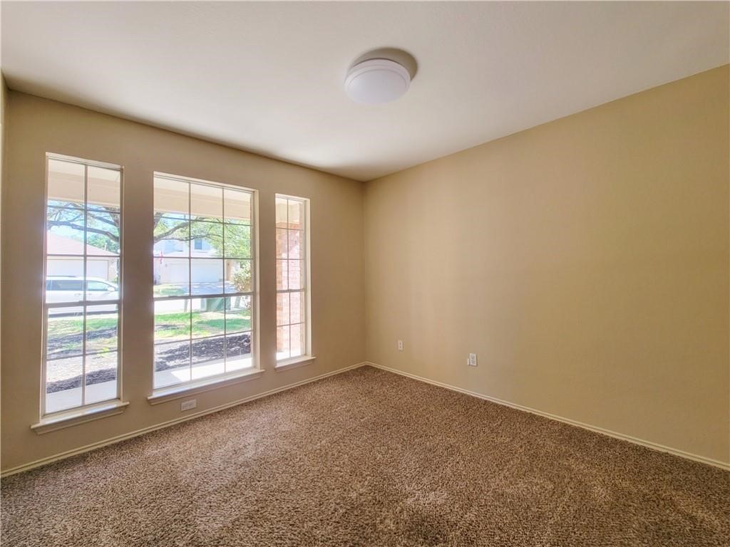 610 Cenizo Path Cedar Park, TX 78613 - Photo 8 of 18 a view of an empty room with a window