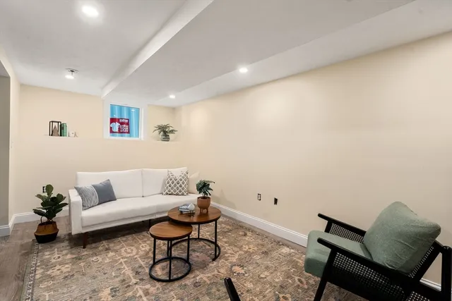 a living room with furniture and white walls