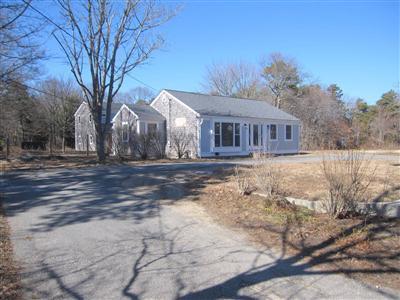 141 Lincoln Road Hyannis, MA 02601 - Photo 1 of 23 a front view of house with yard and trees around