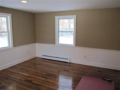 141 Lincoln Road Hyannis, MA 02601 - Photo 12 of 23 an empty room with wooden floor and windows