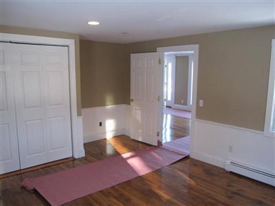 141 Lincoln Road Hyannis, MA 02601 - Photo 13 of 23 an empty room with wooden floor and windows