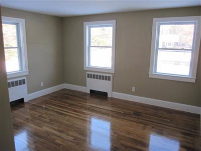 141 Lincoln Road Hyannis, MA 02601 - Photo 14 of 23 a view of an empty room with wooden floor and a window