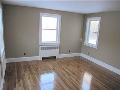 141 Lincoln Road Hyannis, MA 02601 - Photo 15 of 23 an empty room with wooden floor and windows