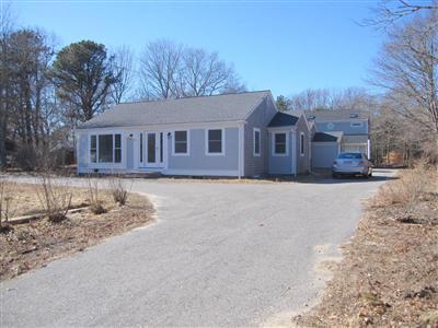 141 Lincoln Road Hyannis, MA 02601 - Photo 2 of 23 front view of a house with a yard