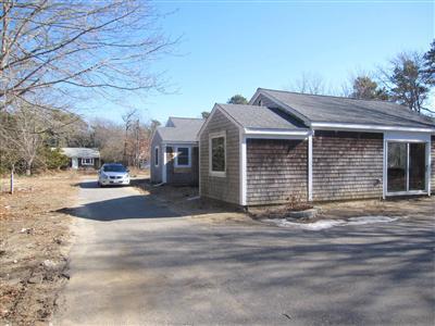 141 Lincoln Road Hyannis, MA 02601 - Photo 23 of 23 a front view of a house with a yard
