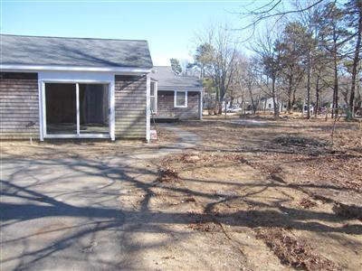 141 Lincoln Road Hyannis, MA 02601 - Photo 4 of 23 a front view of a house with a yard