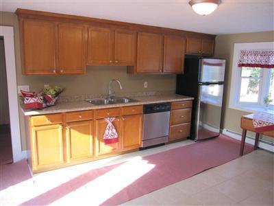 141 Lincoln Road Hyannis, MA 02601 - Photo 7 of 23 a kitchen with stainless steel appliances granite countertop a sink stove and cabinets