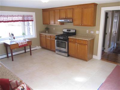141 Lincoln Road Hyannis, MA 02601 - Photo 8 of 23 a kitchen with stainless steel appliances granite countertop a stove a sink and a refrigerator