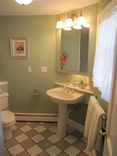 141 Lincoln Road Hyannis, MA 02601 - Photo 10 of 23 a bathroom with a sink and a mirror