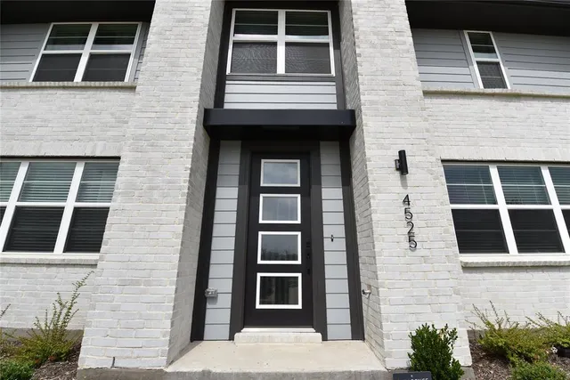 a front view of a house with windows