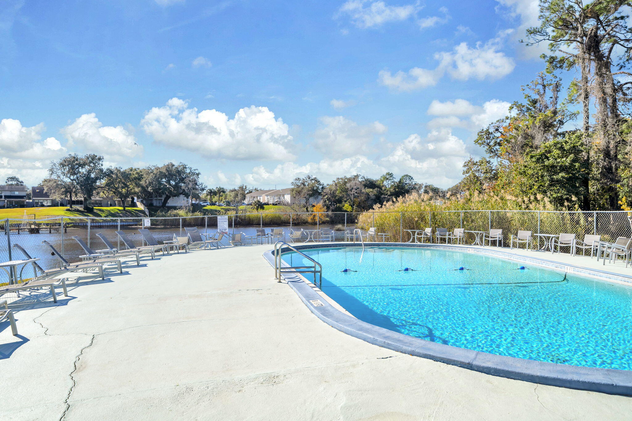 210 Pelham Road, Unit 119B Fort Walton Beach, FL 32547 - Photo 3 of 14 pool with bayou