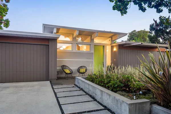 a front view of a house with garden