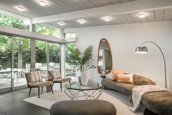 a living room with furniture and a large window