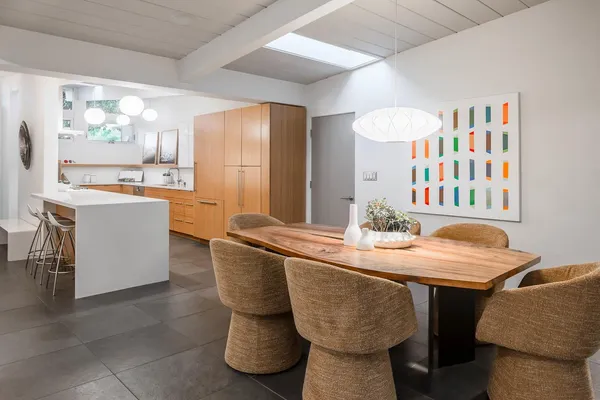 a dining room with furniture and window