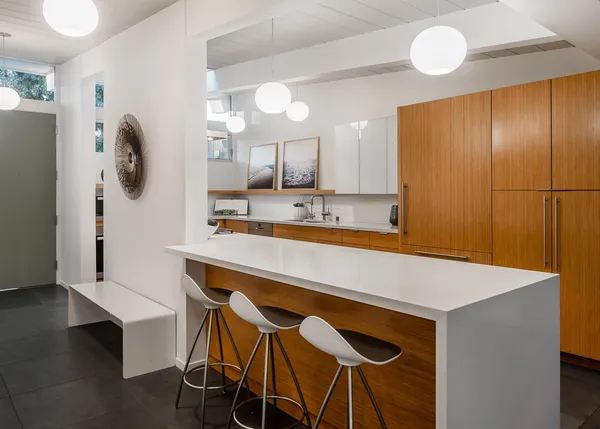 a kitchen with a table and chairs in it