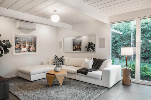 a living room with furniture and a large window