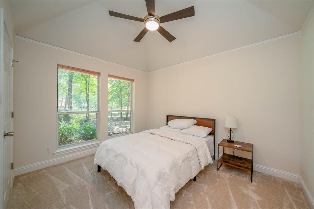 234 Spring Lake Knoll Trail Holly Lake Ranch, TX 75765 - Photo 15 of 20 a bedroom with a bed and a window