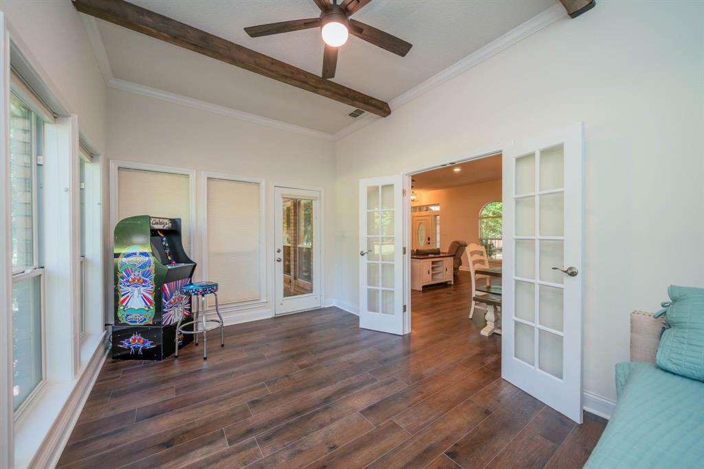 234 Spring Lake Knoll Trail Holly Lake Ranch, TX 75765 - Photo 16 of 20 a view of livingroom with hardwood floor and a ceiling fan