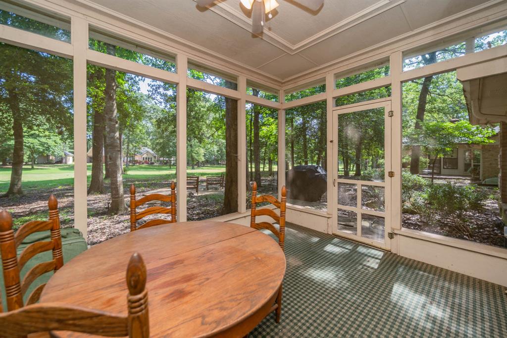 234 Spring Lake Knoll Trail Holly Lake Ranch, TX 75765 - Photo 19 of 20 a bedroom with furniture and large windows