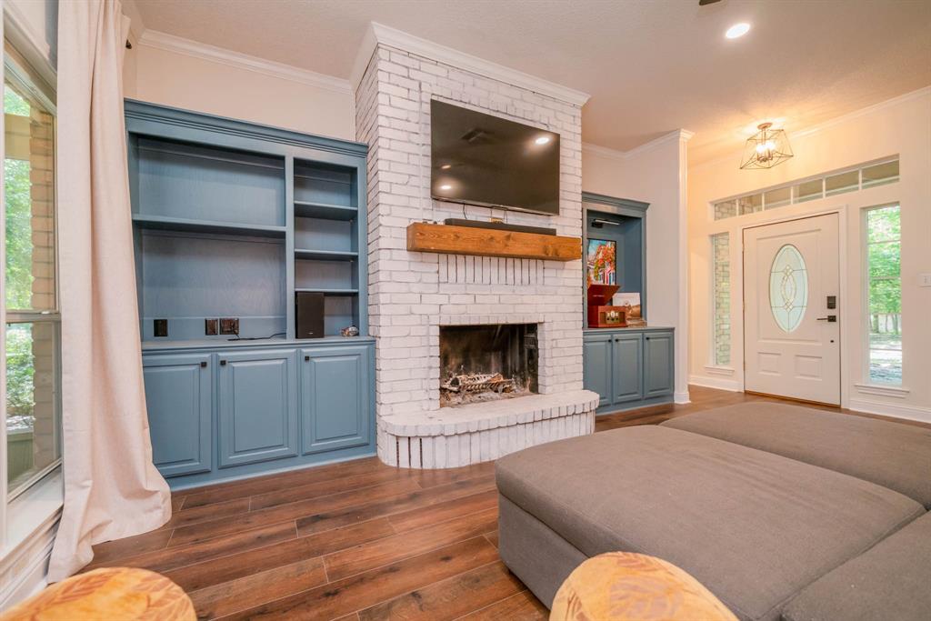 234 Spring Lake Knoll Trail Holly Lake Ranch, TX 75765 - Photo 10 of 20 a living room with furniture and a fireplace