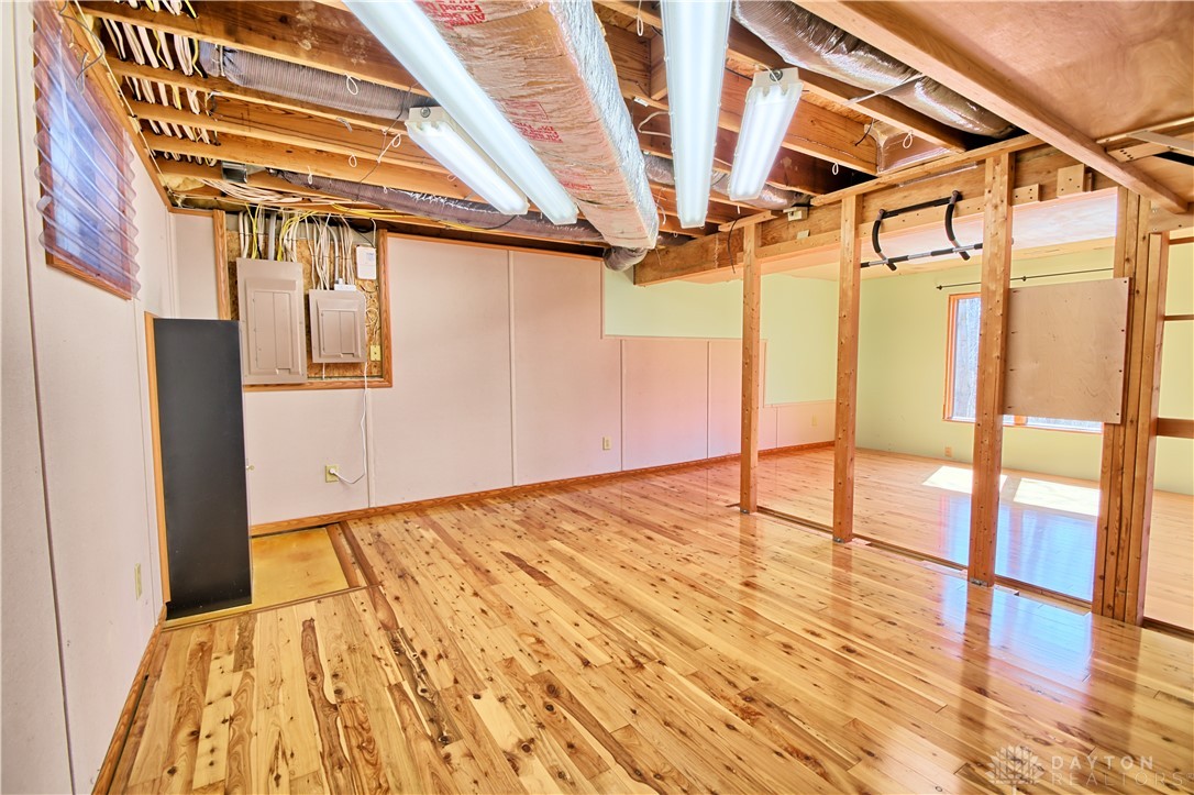 8711 Nicole Lane Springboro, OH 45066 - Photo 62 of 87 This versatile basement space features natural wood flooring, ready for your creative transformation.