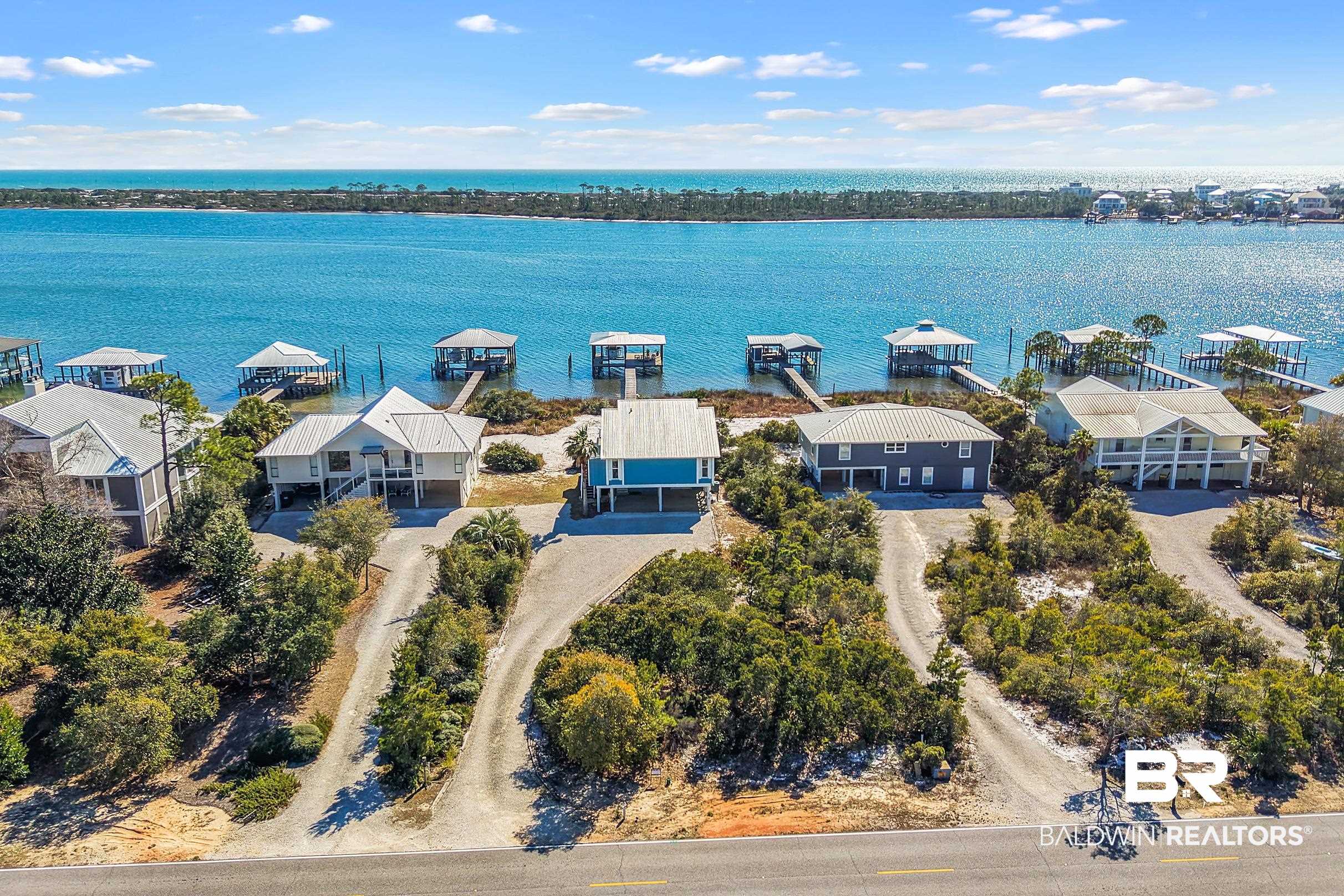 32620 River Road Orange Beach, AL 36561 - Photo 52 of 60 Aerial perspective of suburban area featuring a nearby body of water