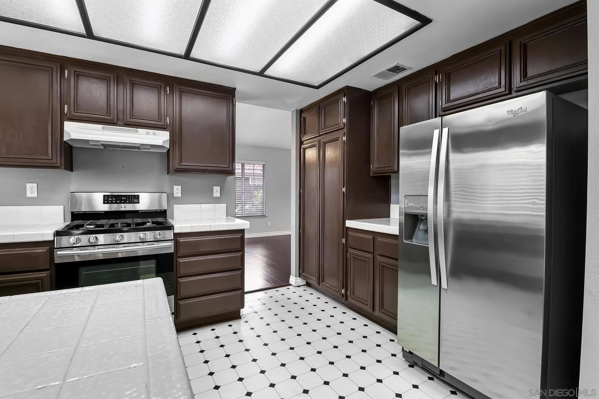 39884 North General Kearny Road Temecula, CA 92591 - Photo 15 of 58 a kitchen with stainless steel appliances granite countertop a refrigerator and a stove