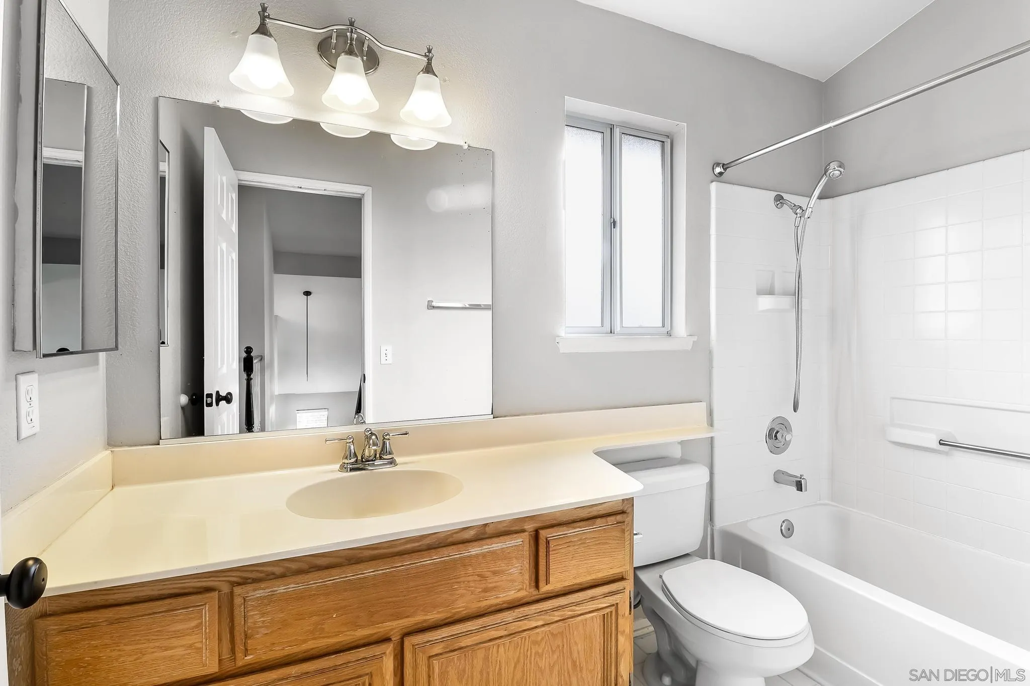 39884 North General Kearny Road Temecula, CA 92591 - Photo 26 of 58 a bathroom with a sink a toilet a mirror and shower